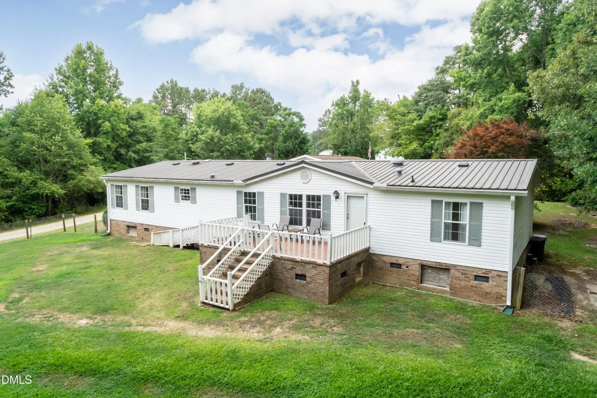 A welcoming home surrounded by mature trees